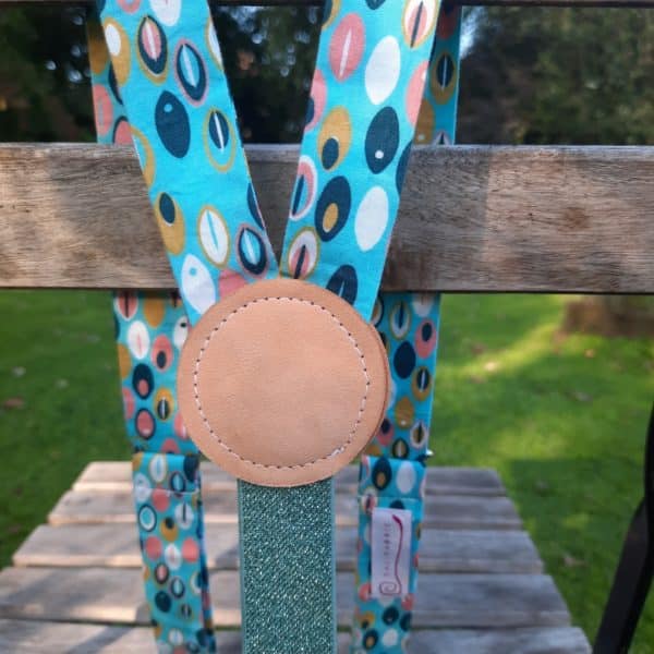 bretelles oeil de chat turquoise et rose